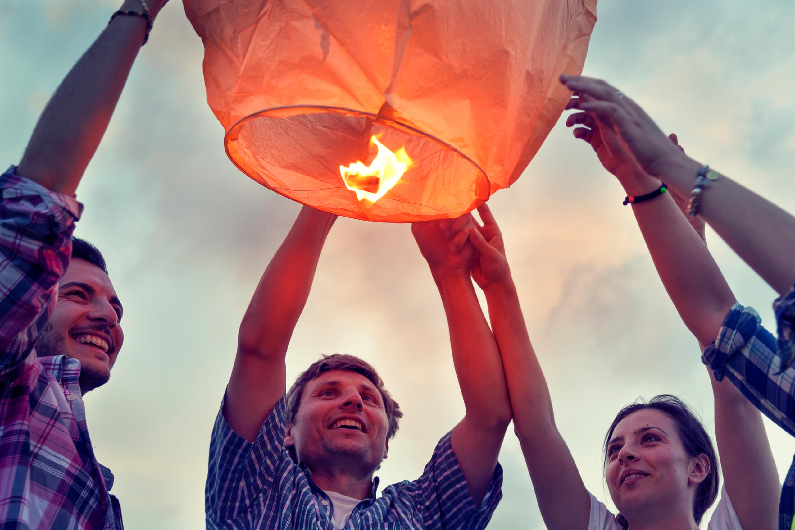 Funeral party lighting lantern for loved one